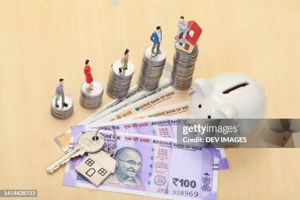 piggy bank and indian currency-concept of investment in real estate - indian economy stock pictures, royalty-free photos & images