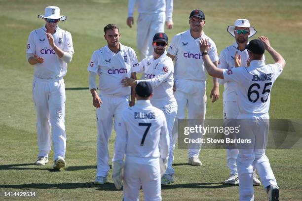 Sam Conners of England Lions celebrates taking the wicket of Marco Jansen of South Africa caught by Sam Billings with his team mates during day four...