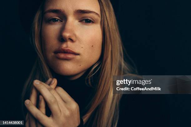 beautiful woman - close up of beautiful young blonde woman with black hat stock pictures, royalty-free photos & images