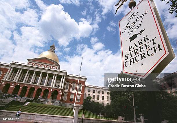 Sidewalk plaque above marks the Freedom Trail, along which can be found the State House and the Park Street Church.