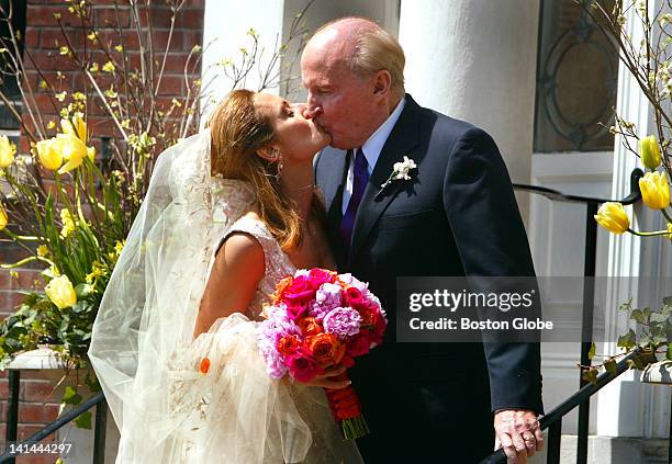 Former General Electric CEO Jack Welch gives his new bride, Suzy Wetlaufer a kiss after the wedding as they arrived at their Beacon Street home for...