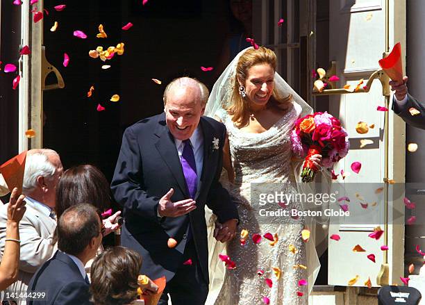 Former General Electric CEO Jack Welch descends the stairs of the Park Street Church with his new wife Suzy Wetlaufer, after their one hour wedding...