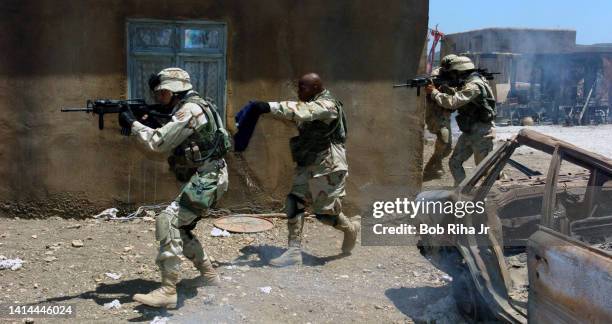 Actors rehearse a scene during filming of FX series 'Over There' , July 1, 2005 in Chatsworth section of Los Angeles, California.
