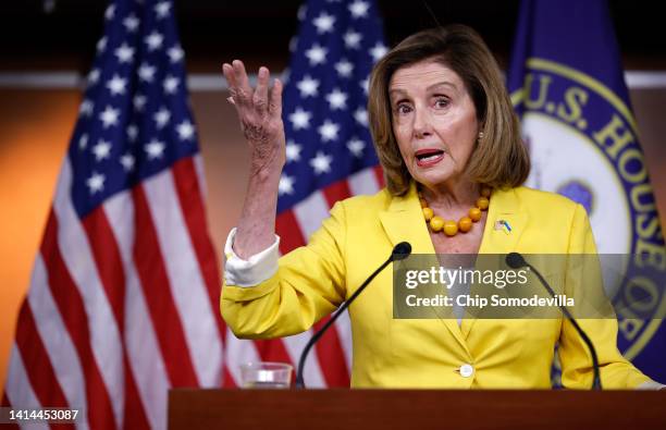 Speaker of the House Nancy Pelosi talks to reporters during her weekly news conference ahead of the vote on the Inflation Reduction Act of 2022 at...