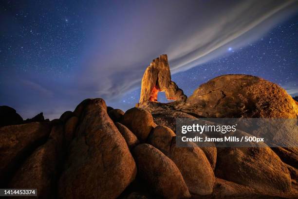 scenic view of rock formation against sky at night,alabama hills,united states,usa - alabama hills stock-fotos und bilder