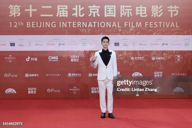 Chinese actor Xu Weizhou arrives at the red carpet of 2022 Beijing International Film Festival on August 12, 2022 in Beijing, China.