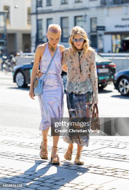 Emma Fridsell wearing silver dress, Gucci bag & Laura Tonder wearing see trough top skirt with print, brown bag seen outside Saks Potts during...