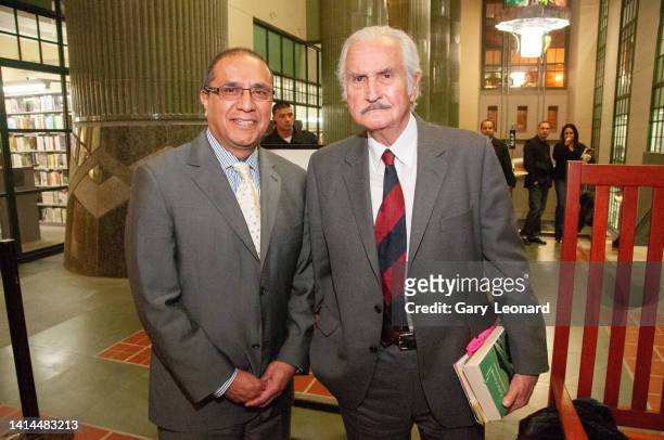 During the Aloud series at the Los Angeles Central Library Mexican author Carlos Fuentes poses for a portrait with LA City Librarian Martin Gomez on...