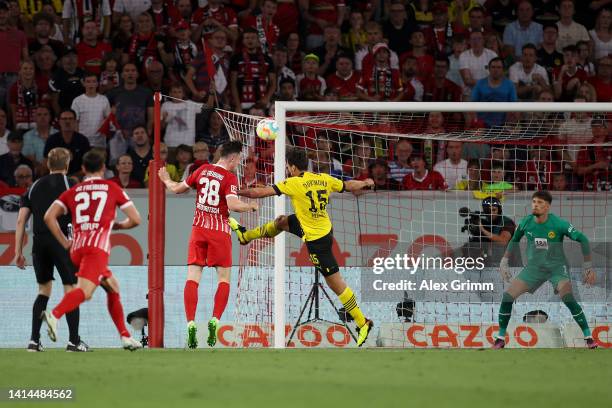 Michael Gregoritsch of SC Freiburg scores their side's first goal w during the Bundesliga match between Sport-Club Freiburg and Borussia Dortmund at...