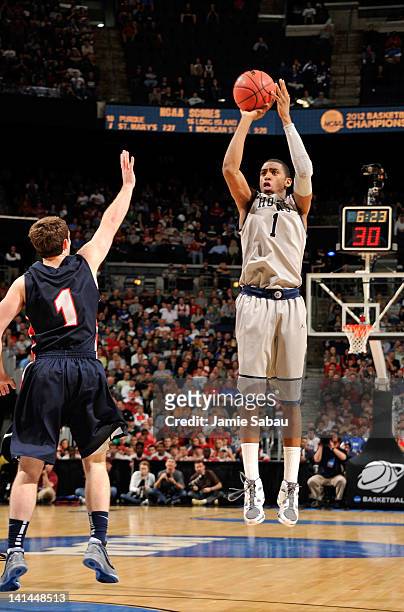 Hollis Thompson of the Georgetown Hoyas shoots against Drew Hanlen of the Belmont Bruins in the first half during the second round of the 2012 NCAA...