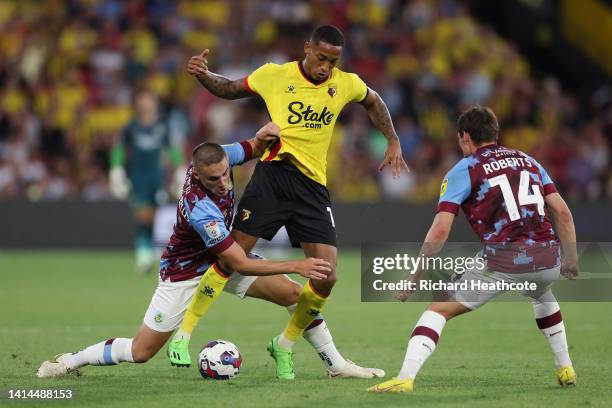 Joao Pedro of Watford is challenged by Taylor Harwood-Bellis of Burnley during the Sky Bet Championship between Watford and Burnley at Vicarage Road...