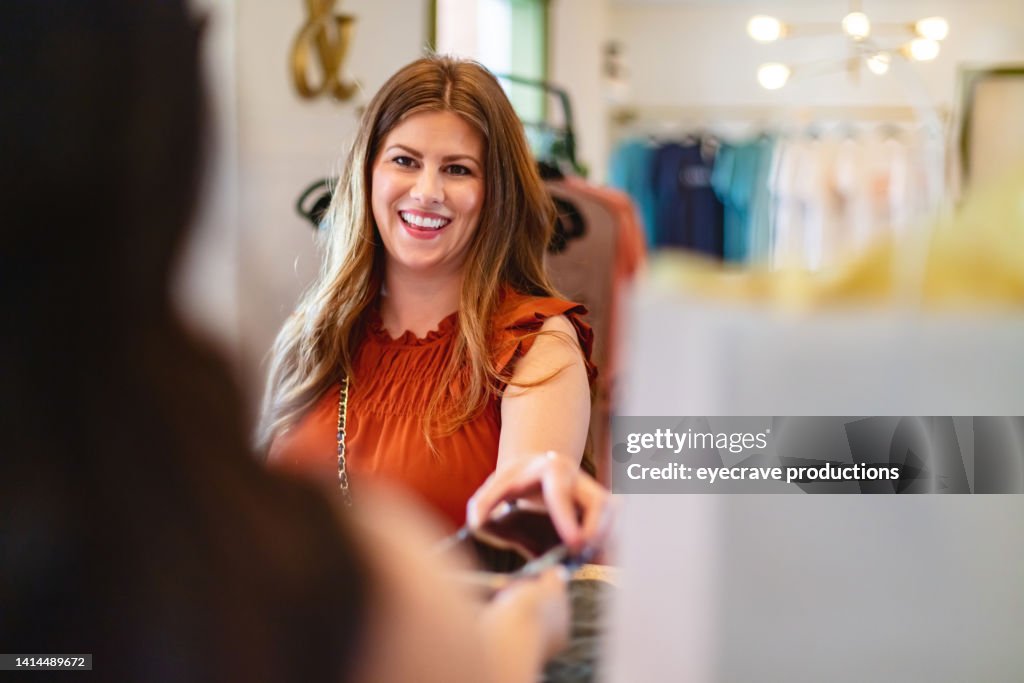 Hispanic and White Females in Small Town America Boutique Using Credit Cards and Electronic Devices Payments on the Go Photo Series