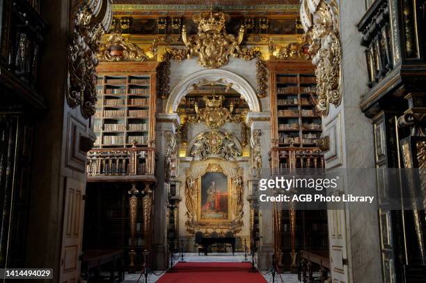 Joanina Library, inside School Palace of the University of Coimbra, Coimbra, Portugal..