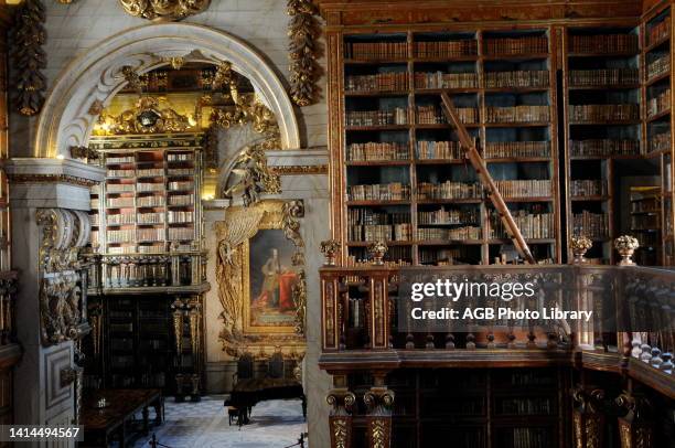 Joanina Library, inside School Palace of the University of Coimbra, Coimbra, Portugal..