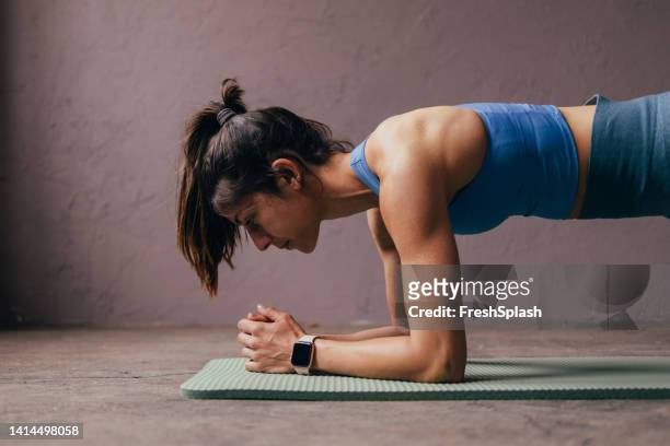 woman doing plank - plank stock pictures, royalty-free photos & images