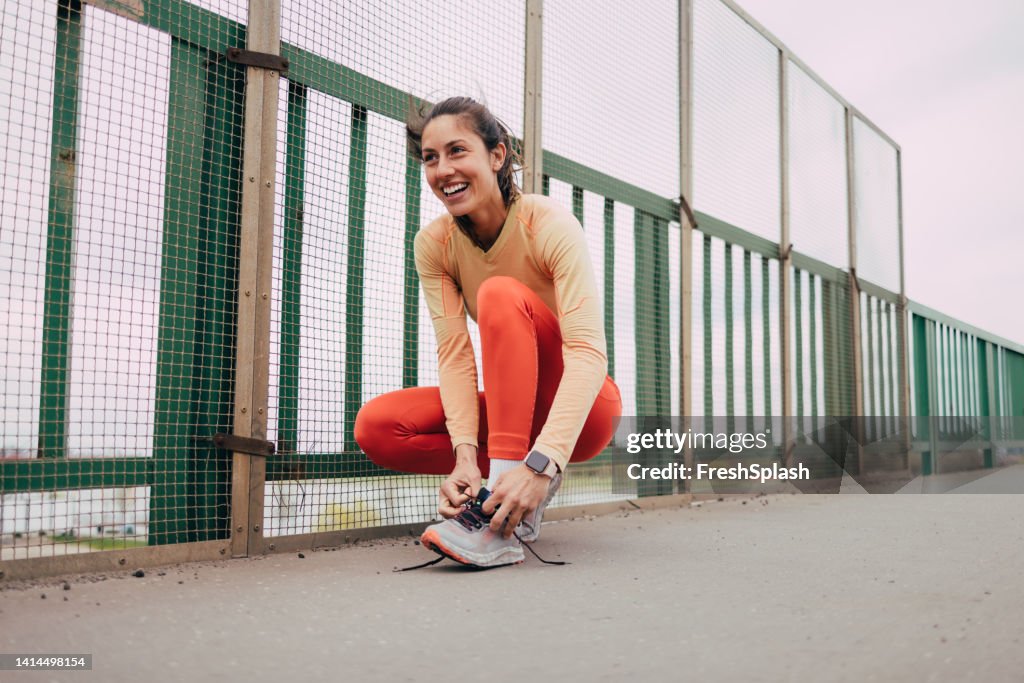Female Athlete Tying Her Shoelaces