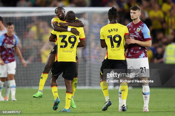 Hassane Kamara celebrates with Edo Kayembe of Watford after the final whistle of the Sky Bet Championship between Watford and Burnley at Vicarage...