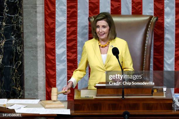 Speaker of the House Nancy Pelosi raps the gavel as she announces the Inflation Reduction Act of 2022 passed 220-207 in the House Chamber at the U.S....