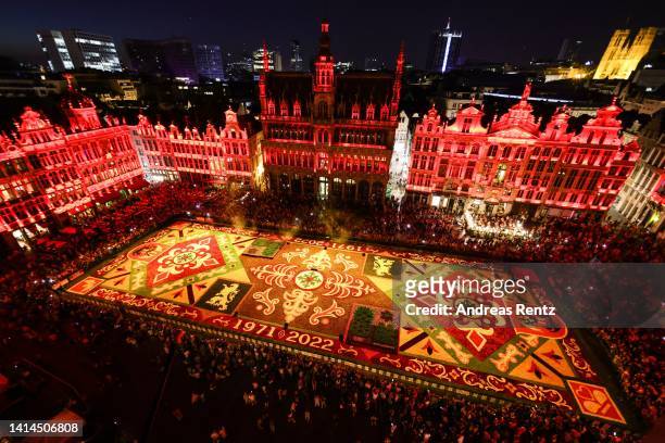 Giant flower carpet stands illuminated within the celebrations to mark its 50th anniversary at Grand Place on August 12, 2022 in Brussels, Belgium....