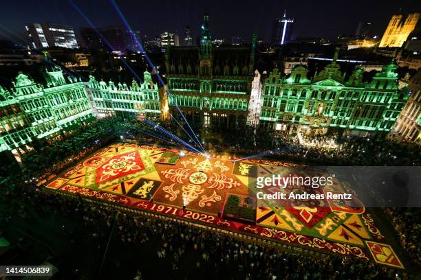 Giant flower carpet stands illuminated within the celebrations to mark its 50th anniversary at Grand Place on August 12, 2022 in Brussels, Belgium....