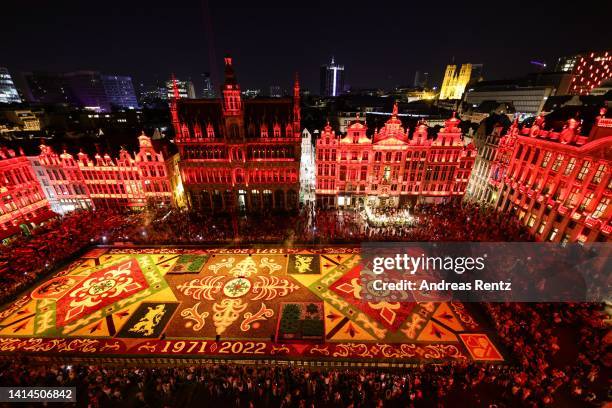 Giant flower carpet stands illuminated within the celebrations to mark its 50th anniversary at Grand Place on August 12, 2022 in Brussels, Belgium....