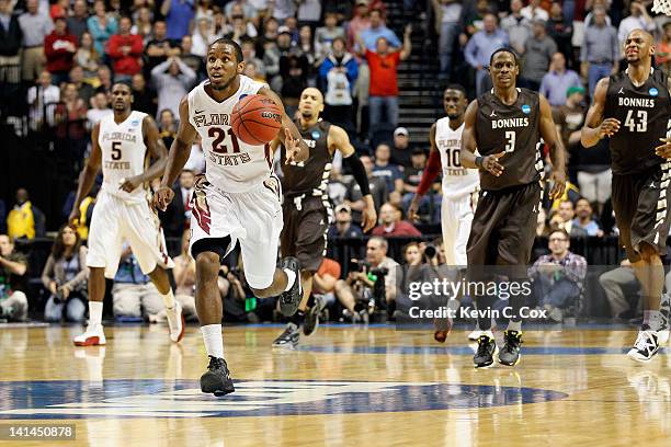 Michael Snaer of the Florida State Seminoles dribbles the ball down court in the final seconds of the game against the St. Bonaventure Bonnies during...