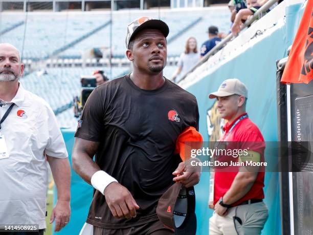 Quarterback Deshaun Watson of the Cleveland Browns talk with fans before the start of a preseason game against the Jacksonville Jaguars at TIAA Bank...