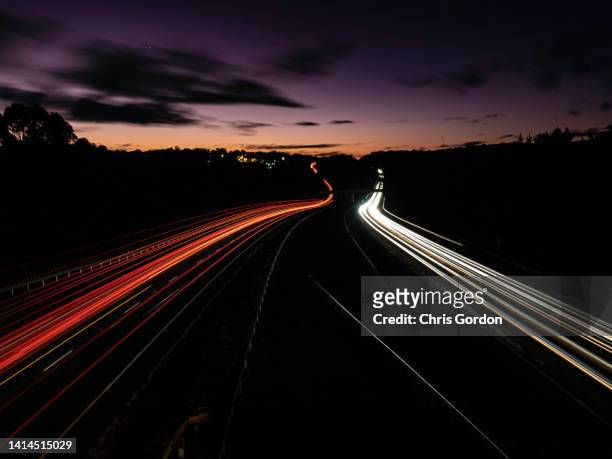car light trails on freeway - vehicle light stock pictures, royalty-free photos & images