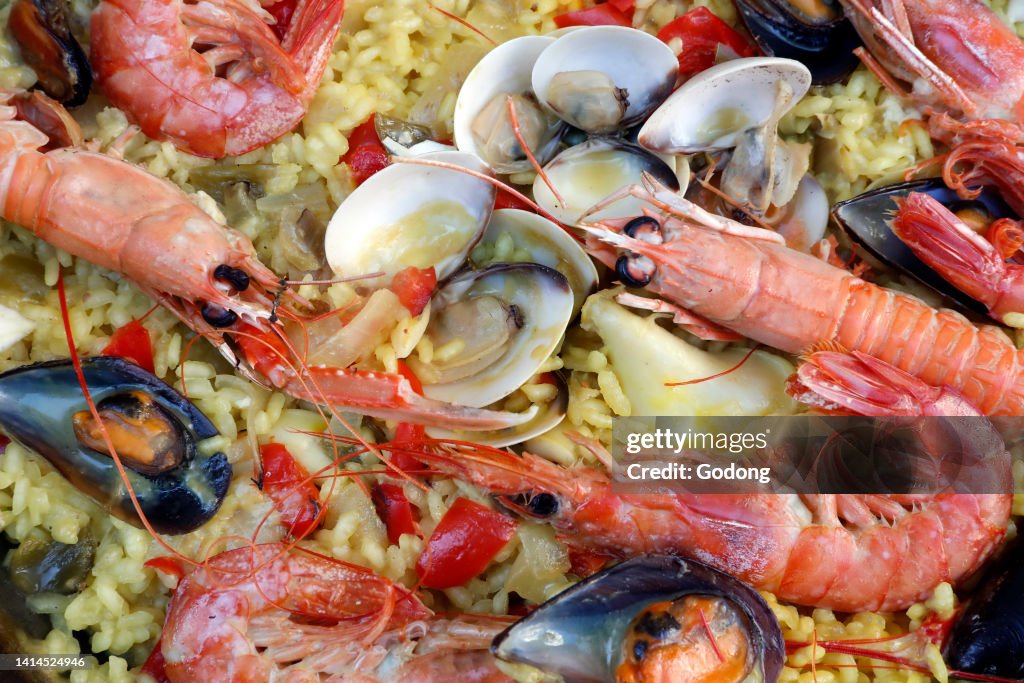 Spanish paella with seafood - king prawns