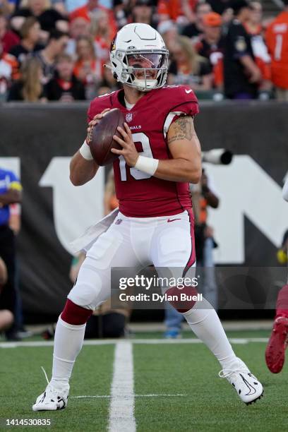Trace McSorley of the Arizona Cardinals drops back to pass in the first quarter against the Cincinnati Bengals during a preseason game at Paycor...