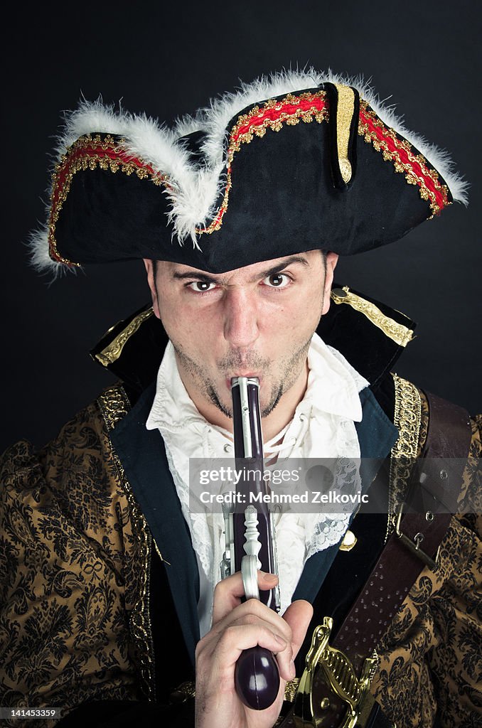 Pirate with gun in his mouth
