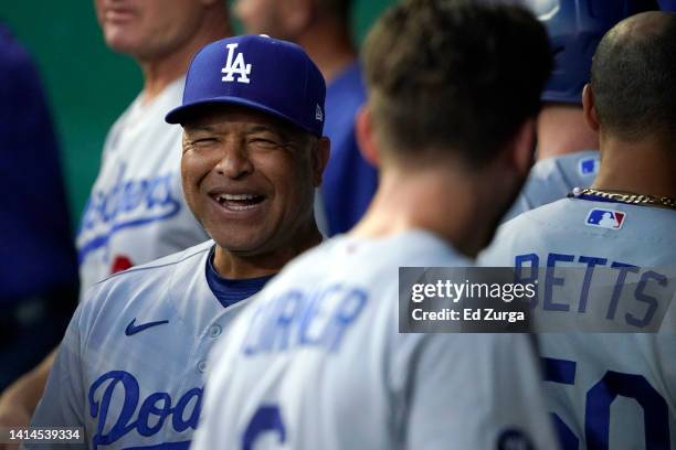 Manager Dave Roberts of the Los Angeles Dodgers walks the dugout in the fourth inning during a game against the Kansas City Royals at Kauffman...