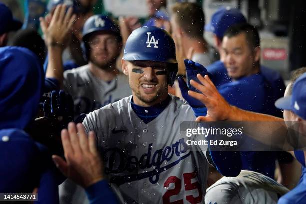 Trayce Thompson of the Los Angeles Dodgers celebrates his three-run home run with teammates in the eighth inning against the Kansas City Royals at...