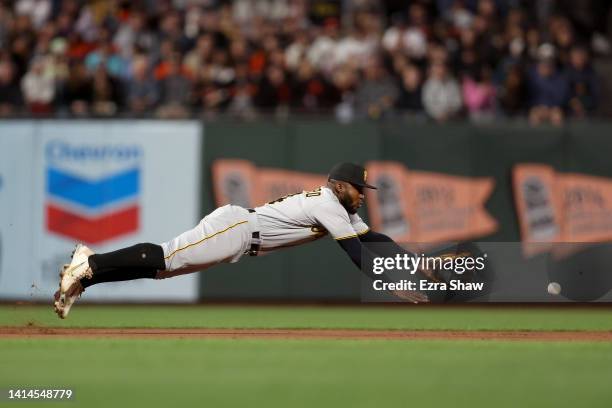 Rodolfo Castro of the Pittsburgh Pirates can not stop a ball hit by Wilmer Flores of the San Francisco Giants in the fifth inning at Oracle Park on...