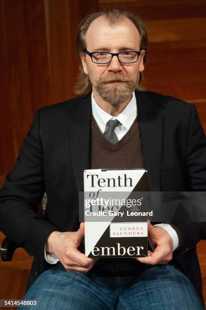 During the Aloud series at the Los Angeles Central Library author George Saunders poses for a portrait with his book Tenth of December on February 6,...