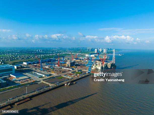 a new fpso vessel (floating production, storage and offloading) at a dockyard under construction - nantong stock pictures, royalty-free photos & images