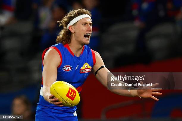 Aaron Naughton of the Bulldogs reacts after giving away a free kick during the round 22 AFL match between the Western Bulldogs and the Greater...