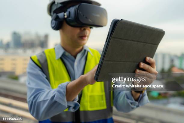 the engineering team using tablets and virtual reality technology for work. - virtual reality point of view stock pictures, royalty-free photos & images