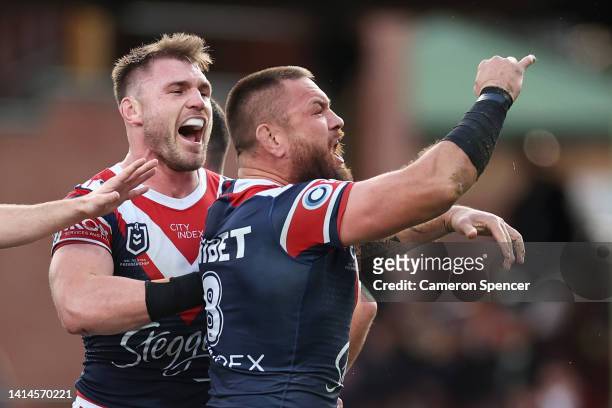 Jared Waerea-Hargreaves of the Roosters celebrates scoring a try with team mates during the round 22 NRL match between the Sydney Roosters and the...