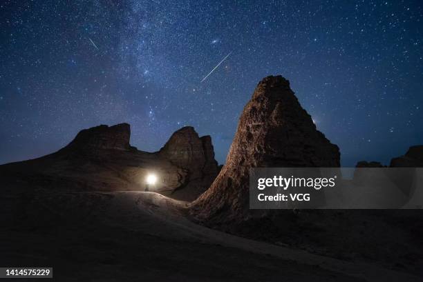 The Perseid meteor shower illuminate the night sky over the Eboliang Yardang landform on August 12, 2022 in Haixi Mongolian and Tibetan Autonomous...
