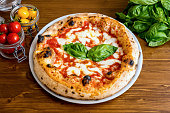 A delicious and tasty Italian pizza Margherita with tomatoes and buffalo mozzarella