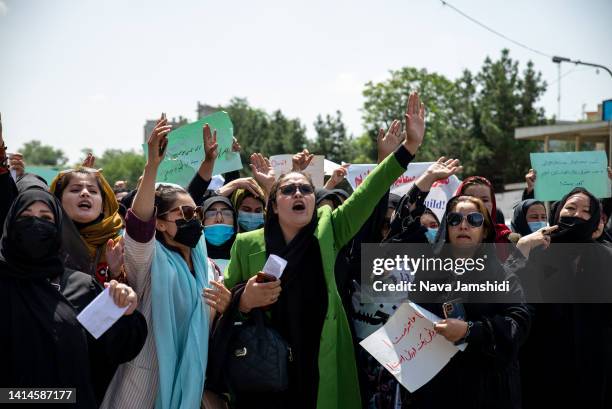 Taliban fighters fired into the air as they dispersed a rare rally by women as they chanted "Bread, work and freedom" and marched in front of the...