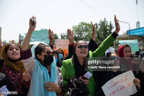 Taliban fighters fired into the air as they dispersed a rare rally by women as they chanted "Bread, work and freedom" and marched in front of the...