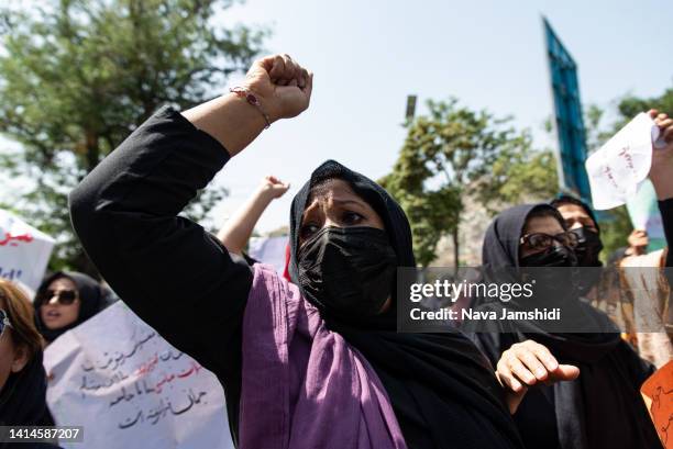 Taliban fighters fired into the air as they dispersed a rare rally by women as they chanted "Bread, work and freedom" and marched in front of the...