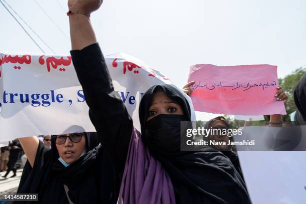 Taliban fighters fired into the air as they dispersed a rare rally by women as they chanted "Bread, work and freedom" and marched in front of the...