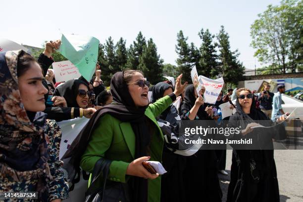 Taliban fighters fired into the air as they dispersed a rare rally by women as they chanted "Bread, work and freedom" and marched in front of the...