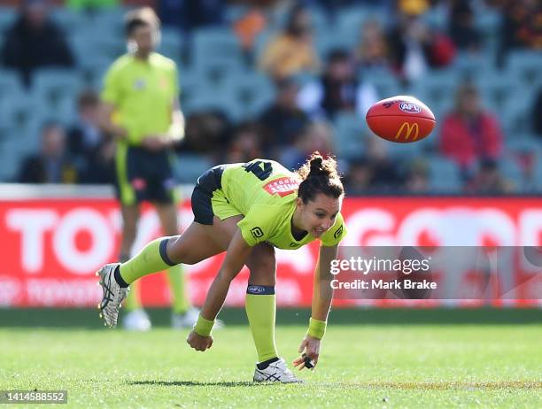 Field umpire Eleni Glouftsis centre bounces during the round 22 AFL match between the Adelaide Crows and the North Melbourne Kangaroos at Adelaide...