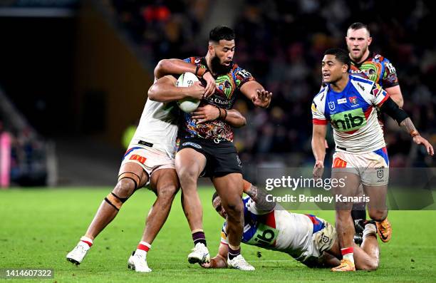 Payne Haas of the Broncos takes on the defence during the round 22 NRL match between the Brisbane Broncos and the Newcastle Knights at Suncorp...