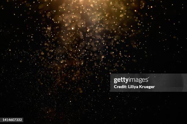 abstract gold glitter/dusk background. - paranormaal stockfoto's en -beelden