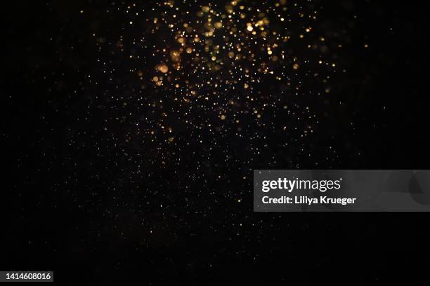 abstract gold glitter/dusk background. - glitter fotografías e imágenes de stock